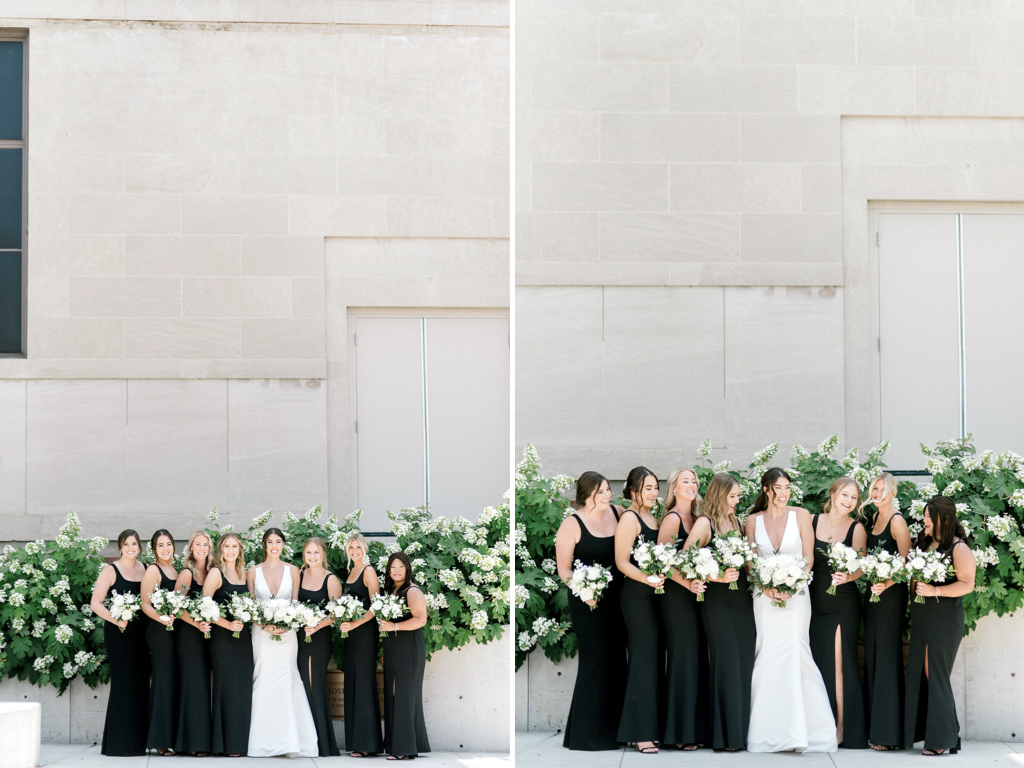 Bridesmaids wear black dresses gathered around the bride